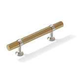 Gold cabinet handle with silver accents on a white background