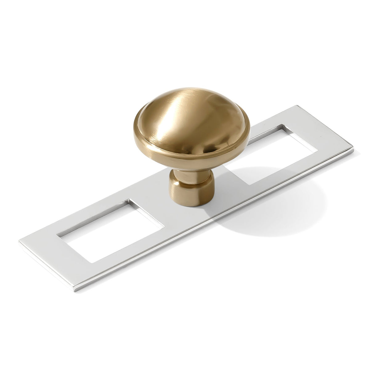 Gold cabinet knob with a white rectangular plate on a white background