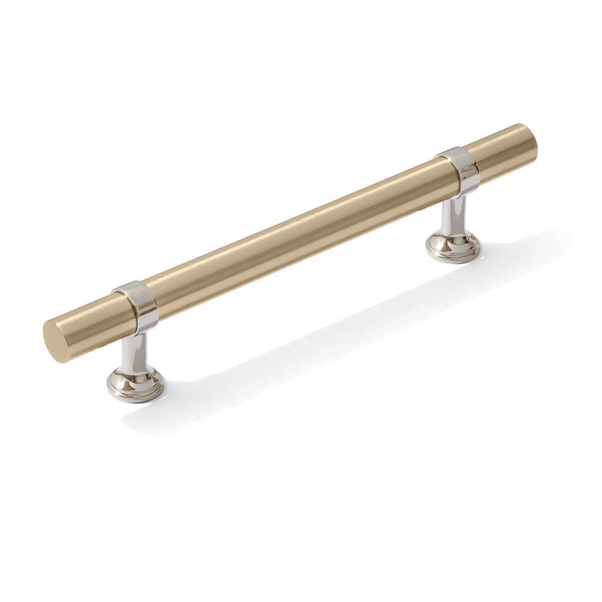 Gold cabinet handle with silver accents on a white background