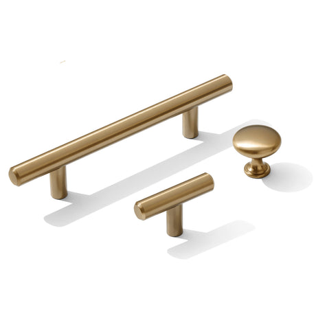 Set of champagne bronze cabinet handles on a white background